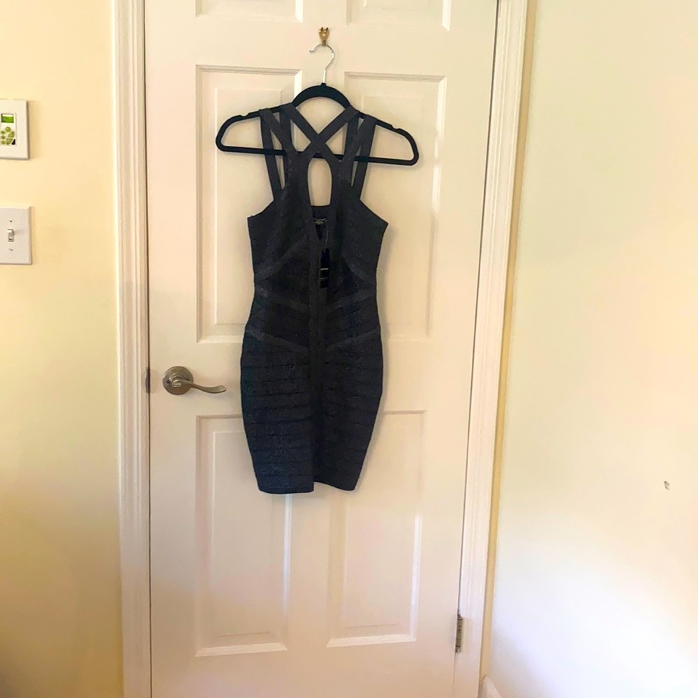 Brand new Bebe body on minidress stretch material black with silver threading